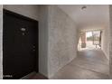 Building entryway with a dark door and light-colored walls at 3302 N 7Th St # 133, Phoenix, AZ 85014