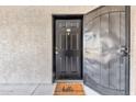 Apartment entry with black door and metal security gate at 3302 N 7Th St # 366, Phoenix, AZ 85014