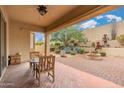 Covered patio with seating area and access to backyard at 33612 N 24Th Dr, Phoenix, AZ 85085