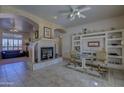 Bright dining area with fireplace and built-in shelves at 35849 N 3Rd St, Phoenix, AZ 85086