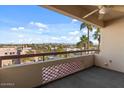 Spacious balcony with city views and palm trees at 4200 N Miller Rd # 526, Scottsdale, AZ 85251