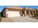 View of the home's front and garage at 42276 W Chisholm Dr, Maricopa, AZ 85138