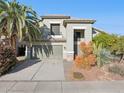 Two-story house with a two-car garage and desert landscaping at 4376 E Anderson Dr, Phoenix, AZ 85032