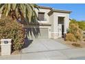 Two-story house with a two-car garage and desert landscaping at 4376 E Anderson Dr, Phoenix, AZ 85032