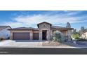 Single story home with stone accents and a two car garage at 4557 W Agave Ave, Eloy, AZ 85131