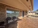 Spacious covered patio with tile flooring and wicker chairs at 4624 E Emerald Ave, Mesa, AZ 85206