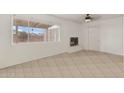 Bright living room with tile flooring and fireplace at 4809 W Sandra Ter, Glendale, AZ 85306