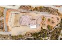 Overview of the house and surrounding area from above at 5063 E Reavis St, Apache Junction, AZ 85119