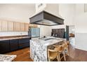 Open kitchen layout featuring a large island, granite countertops, and modern appliances perfect for entertaining and everyday living at 5582 W Aster Dr, Glendale, AZ 85304