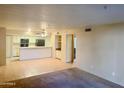 Open kitchen with breakfast bar and appliances at 7777 E Main St # 215, Scottsdale, AZ 85251