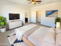 Large main bedroom with ample space and an ensuite bathroom at 8148 W Atlantis Way, Phoenix, AZ 85043