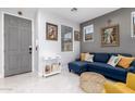 Living room with sectional sofa, accent chair, and coffee table at 850 E Del Rio St, Chandler, AZ 85225