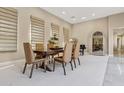 Spacious dining room with a modern wooden table and neutral color palette at 8534 E Angel Spirit Dr, Scottsdale, AZ 85255