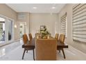 Open and airy dining room with a large table and access to a patio at 8534 E Angel Spirit Dr, Scottsdale, AZ 85255