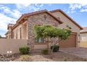 Spanish style home with stone and stucco exterior at 8725 E Indigo St, Mesa, AZ 85207