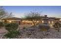 Desert home with landscaped yard, driveway, and two-car garage at 9505 E Superstition Mountain Dr, Gold Canyon, AZ 85118