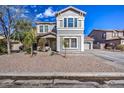 Two-story house with a landscaped front yard and stone driveway at 9778 E Barley Rd, Florence, AZ 85132