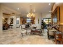 Open floor plan showcasing a formal living area with a view into the kitchen at 11501 E Mark Ln, Scottsdale, AZ 85262