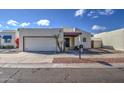 House exterior, featuring a single-car garage and walkway at 11616 N 30Th Ln, Phoenix, AZ 85029