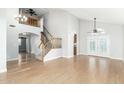 Bright living room with hardwood floors and a staircase to upper level at 1209 N Newport St, Chandler, AZ 85225