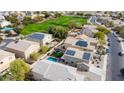 Aerial view of backyard, pool, and community green space at 12378 W Roma Ave, Avondale, AZ 85392