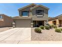 Charming two-story home featuring a two-car garage and a welcoming front porch at 12378 W Roma Ave, Avondale, AZ 85392