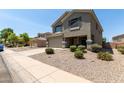 Charming two-story home featuring a two-car garage and a welcoming front porch at 12378 W Roma Ave, Avondale, AZ 85392