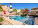 This backyard features a refreshing pool, perfect for outdoor relaxation and enjoyment at 12378 W Roma Ave, Avondale, AZ 85392