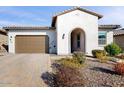 Single-story home with a two-car garage and landscaped front yard at 13360 W Red Hawk Dr, Peoria, AZ 85383