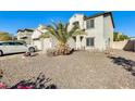 Landscaped front yard with gravel and a palm tree at 14206 W Mandalay Ln, Surprise, AZ 85379