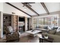 Living room with fireplace, built-in shelving, and comfortable seating at 1498 Leisure World --, Mesa, AZ 85206