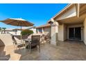 Covered patio with seating area, umbrella, and tile flooring at 1498 Leisure World --, Mesa, AZ 85206