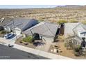 Single-story house situated on a quiet street with mountain views at 1866 N 214Th Ln, Buckeye, AZ 85396