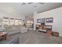 Spacious living room featuring a comfortable sectional sofa and built-in shelving at 18840 N 83Rd Ln, Peoria, AZ 85382