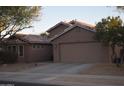 Single story home with two-car garage and desert landscaping at 2425 E Durango Dr, Casa Grande, AZ 85194