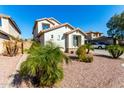 Two-story house with a landscaped yard and driveway at 25822 W Magnolia St, Buckeye, AZ 85326