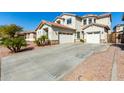 Two-story house with a double garage and driveway at 25822 W Magnolia St, Buckeye, AZ 85326