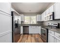 Modern kitchen with stainless steel appliances and granite countertops at 30573 N Royal Oak Way, San Tan Valley, AZ 85143