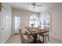 Charming dining area with a wooden table and access to the backyard at 4116 E Sunnyside Dr, Phoenix, AZ 85028