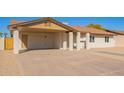 Single-story home featuring a covered carport and desert landscaping at 4220 W State Ave, Phoenix, AZ 85051