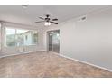 Sun-drenched sunroom with tile flooring and sliding glass doors at 5804 E Dallas St, Mesa, AZ 85205