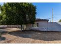 Landscaped backyard with gravel and large shade tree at 7004 N 11Th Way, Phoenix, AZ 85020