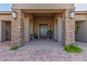 Covered front entrance with stone pillars, lighting, and a double-door entry at 7456 S Brighton --, Queen Creek, AZ 85142