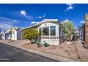 Single wide manufactured home with a covered carport at 7750 E Broadway Rd # 684, Mesa, AZ 85208