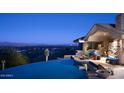 Stunning infinity pool with city and mountain views at 8060 N Mummy Mountain Rd, Paradise Valley, AZ 85253