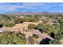 Expansive property with stunning views of the surrounding landscape and distant mountains at 9980 E Charter Oak Rd, Scottsdale, AZ 85260