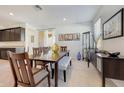 Dining room with wood table, bench seating, and decorative accents at 12530 W Levi Dr, Avondale, AZ 85323