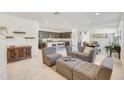 Open living space with kitchen, island, and comfortable seating at 12530 W Levi Dr, Avondale, AZ 85323