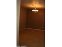 Spacious dining room with tile floors and a chandelier at 17274 W Morning Glory St, Goodyear, AZ 85338