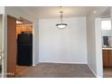 Spacious dining room featuring neutral walls and access to the kitchen and bathroom at 1825 W Ray Rd # 2031, Chandler, AZ 85224